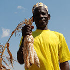 WCS staff working with Kubulau community members to adapt their management plan A maize farmer in Tanzania